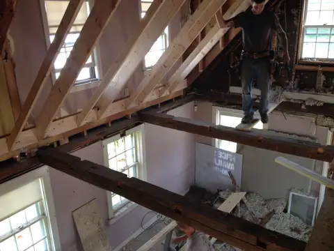 Salon space under construction, exposed beams and ladders