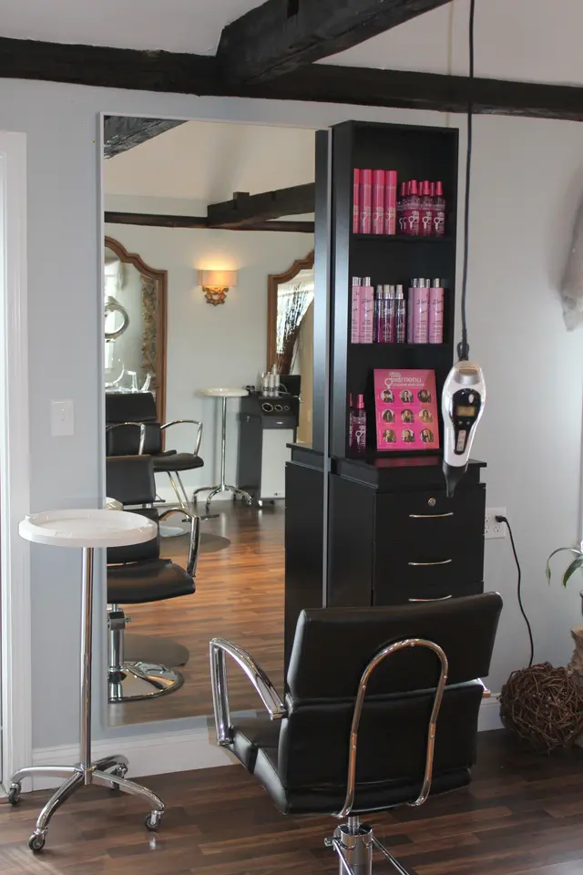 Styling station and product shelves inside the Razoux & Co Blow Out Bar