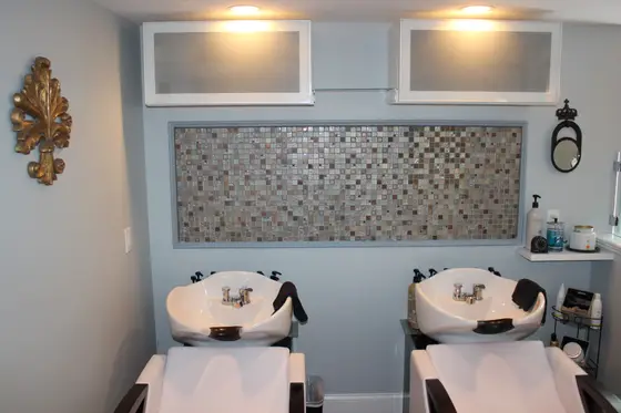Two white shampoo bowls