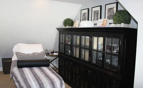 Upstairs salon area with display cabinet