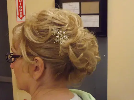 Blonde updo with a jeweled hair clip