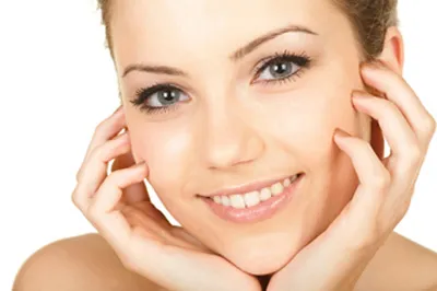Smiling woman with a fresh, smooth complexion